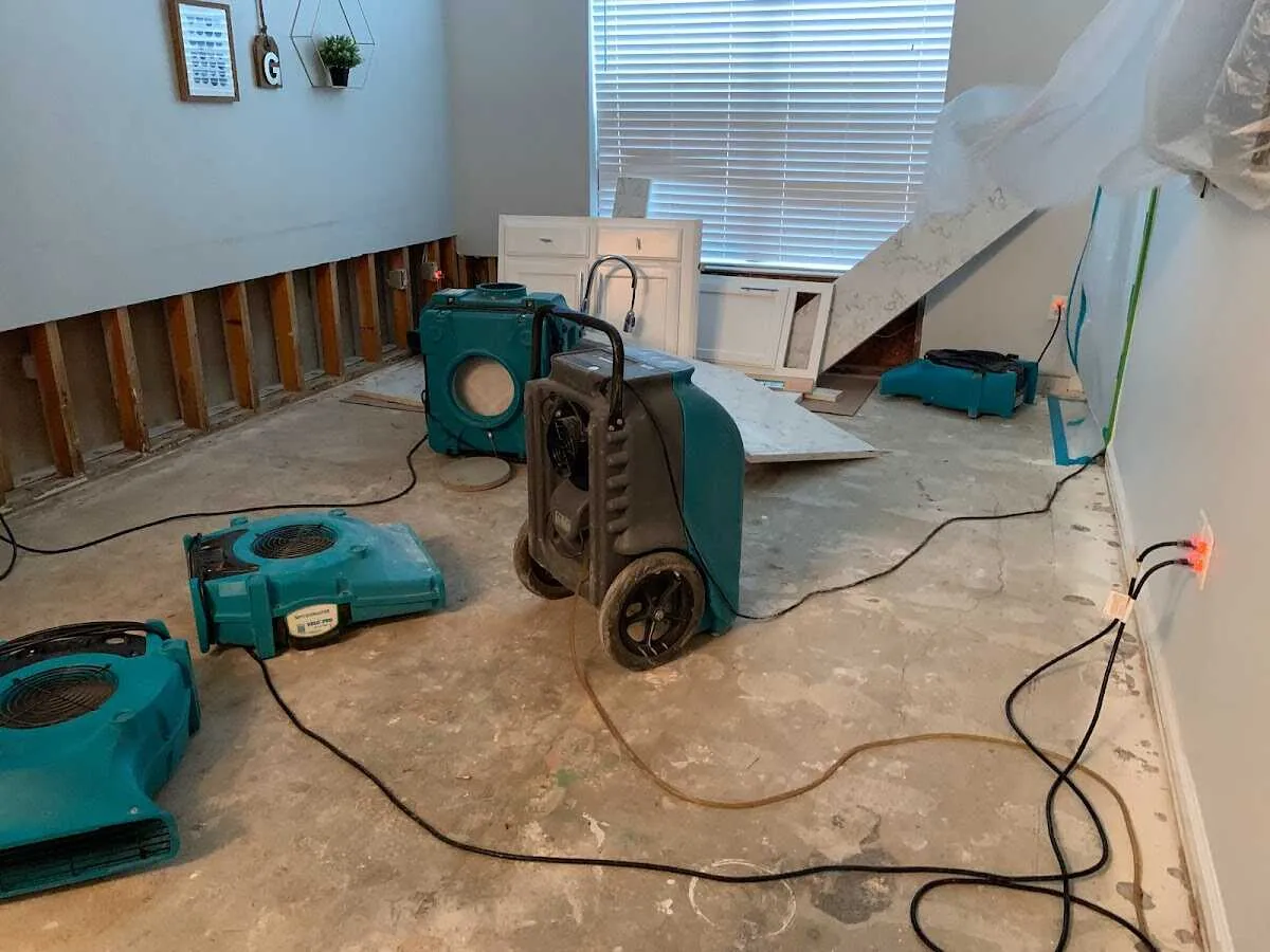 Dehumidifier in flood-cut room for Water Damage Restoration in Federal Heights